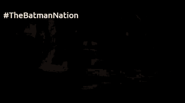 a blurred image of a person 's feet with #thebatmannation written on the bottom