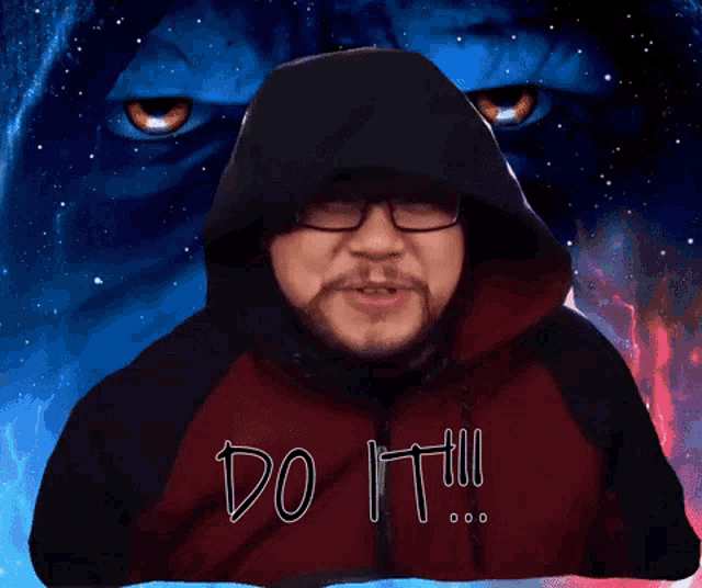 a man in a hooded jacket says do it in front of a blue background