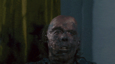 a close up of a man 's face covered in a thick layer of dirty skin
