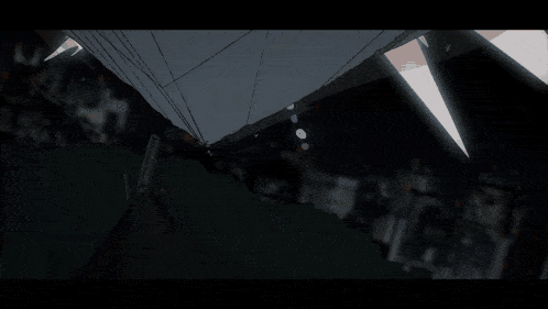 a cartoon drawing of a building being destroyed with boxes flying in the air