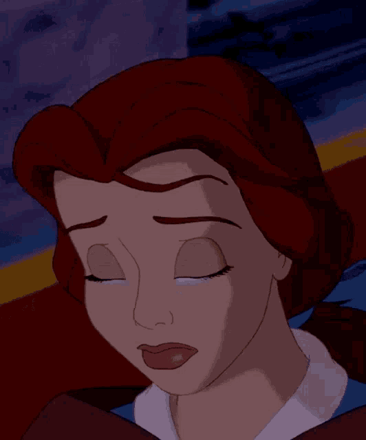 belle from beauty and the beast is crying with a tear running down her cheek