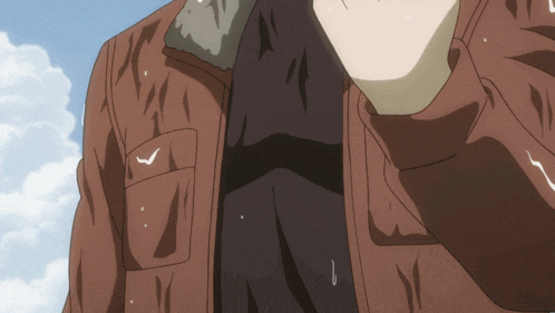 a close up of a person 's chest with a brown jacket on