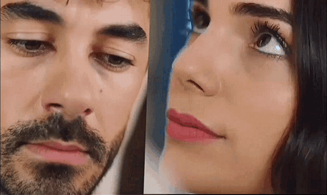 a man and a woman are looking at each other . the woman has red lipstick on her lips .
