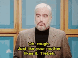 a man with a beard and a suit says " oh rough just like your mother likes it trebek "