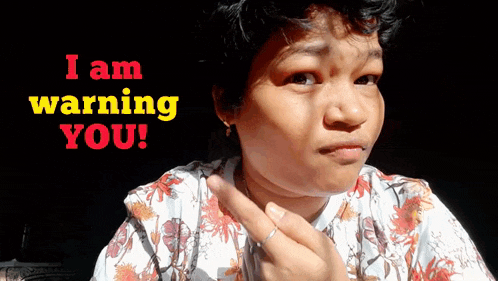 a woman making a funny face with the words i am warning you behind her