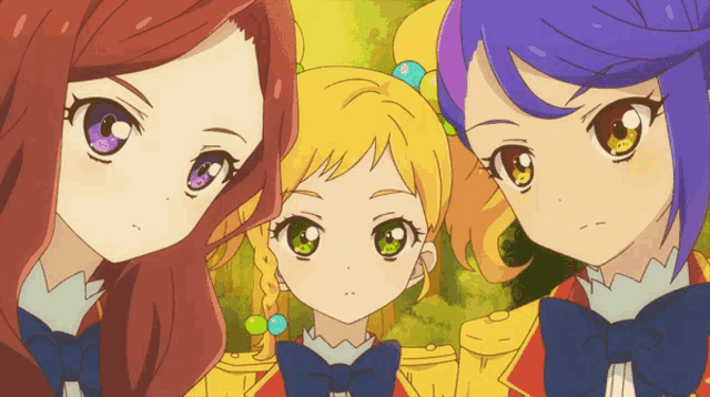 a group of three anime girls are posing for a picture