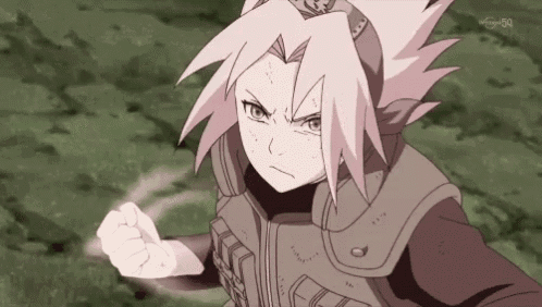 a girl with pink hair and a crown on her head is making a fist .