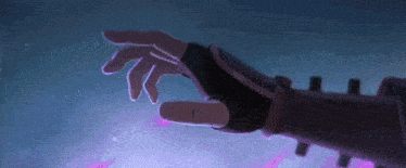 a person 's hand is reaching out towards a purple object .