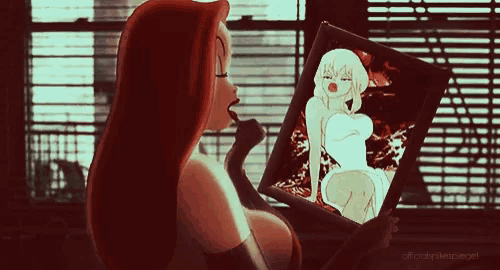 a woman is looking at herself in a mirror