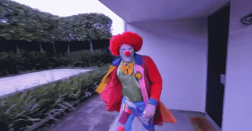 a pixelated image of a clown wearing a red hat