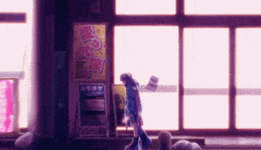 a girl stands in front of a sign that says " karaoke "