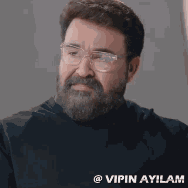 a man with glasses and a beard has the name vipin ayiram on the bottom right