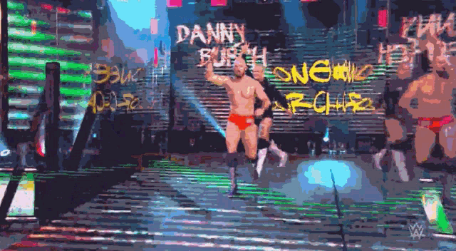 a pixelated image of a wrestling match with the name danny burch on the wall