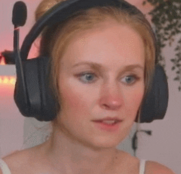 a woman is wearing headphones with a microphone attached to them .