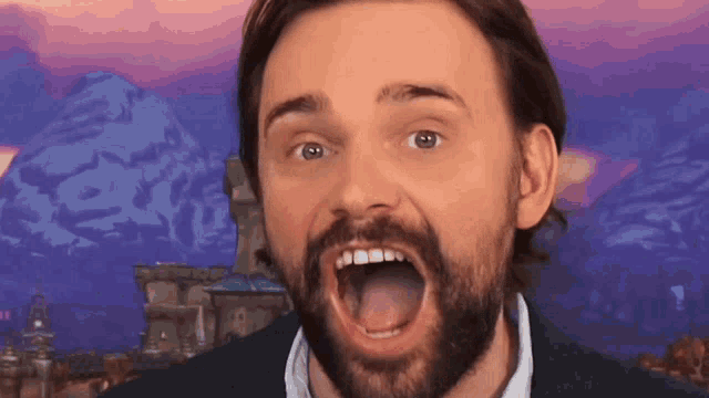 a man with a beard has his mouth wide open