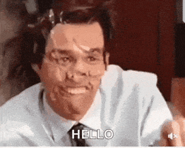 a man with tape on his face is saying hello .