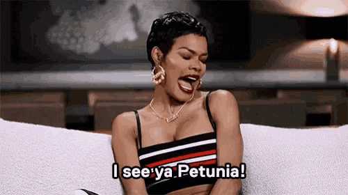 a woman is sitting on a couch with her mouth open and the words i see ya petunia above her