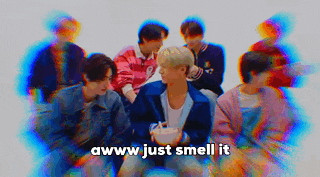 a group of young men are sitting next to each other with the words awww just smell it written in the middle .