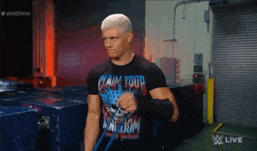 a man wearing a shirt that says claim your kingdom on it