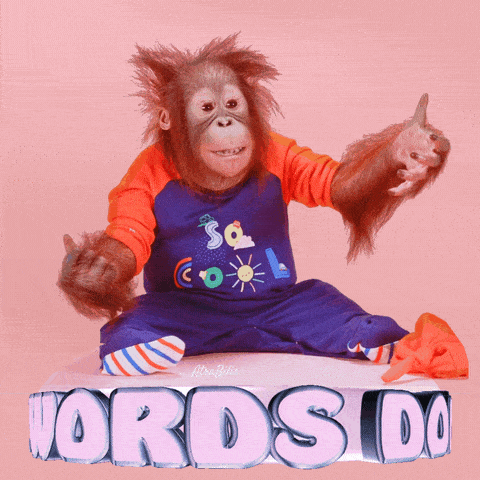 a baby monkey is sitting on a box with the word words do on it