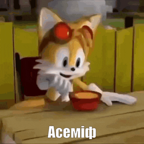tails from sonic the hedgehog is sitting at a table with a bowl of food and a caption that says acemidp