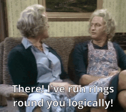 two women are sitting on a couch and one of them says there i 've run rings round you logically