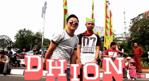 a man wearing a shirt that says d7 is standing next to another man wearing sunglasses