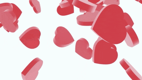 a bunch of red hearts floating in the air