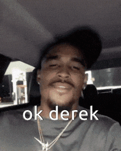 a man wearing a hat and a necklace says ok derek