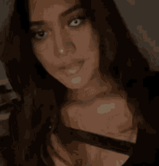 a close up of a woman 's face with a smile on her face
