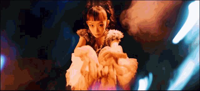 a woman in a fur coat is looking at something in the dark