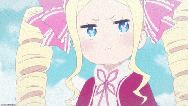 a girl with blonde hair and a pink bow in her hair looks angry