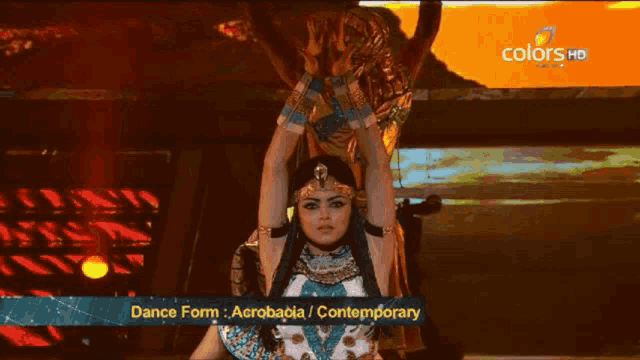 a woman in a costume performs a dance form called acrobacia / contemporary