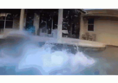 a house with a pool in front of it