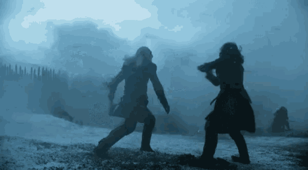 two people are fighting in the snow with swords in the dark .