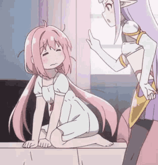 a girl with pink hair is kneeling down next to a purple girl .