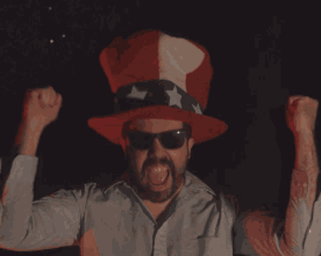 a man wearing an uncle sam hat and sunglasses is saying yes