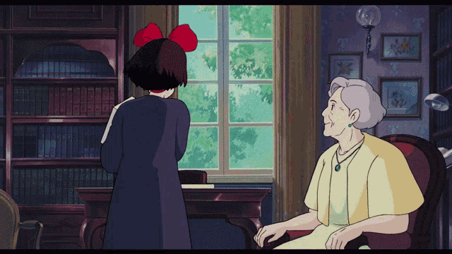 a girl with a red bow on her head stands next to an older woman