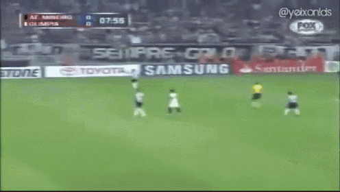 a soccer game is being played in front of a bridgestone and samsung advertisement