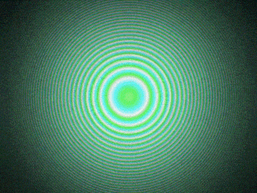a green and blue circle on a green background