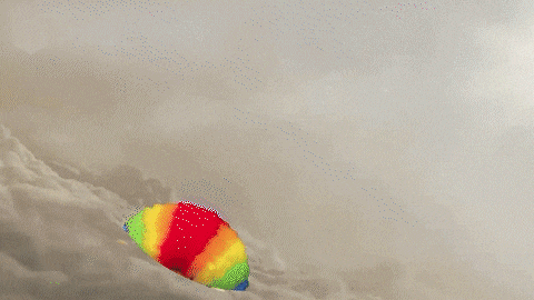a rocket is flying through a cloudy sky and exploding .