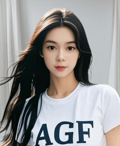 a woman wearing a white t-shirt with the word agf on it