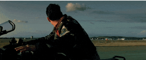 a man riding a motorcycle with a patch on his jacket that says ' u.s. air force ' on it