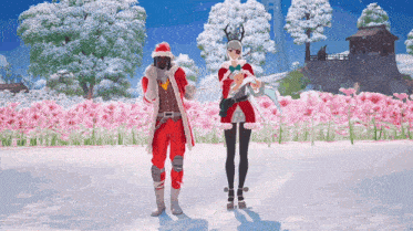 a man and a woman dressed in santa costumes are standing in a field of pink flowers