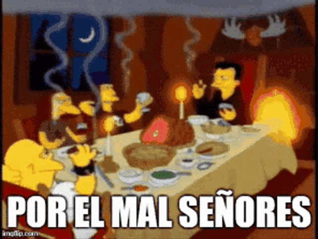 a group of people sitting around a table with the words por el mal señores