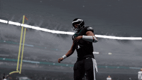 a football player with the number 1 on his jersey is throwing a football