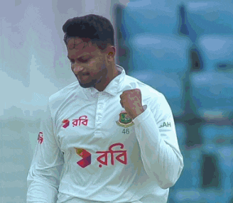 a cricket player wearing a white shirt with the number 46 on it .