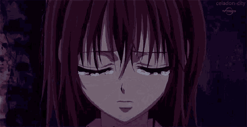 a close up of a crying anime girl with tears coming out of her eyes .