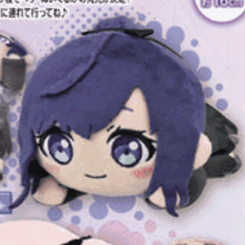 a stuffed doll with purple hair and blue eyes is laying down