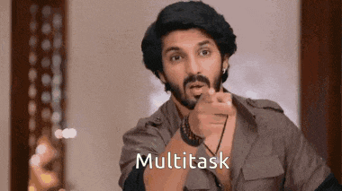 a man with a beard is pointing at the camera with the word multitask written on the bottom